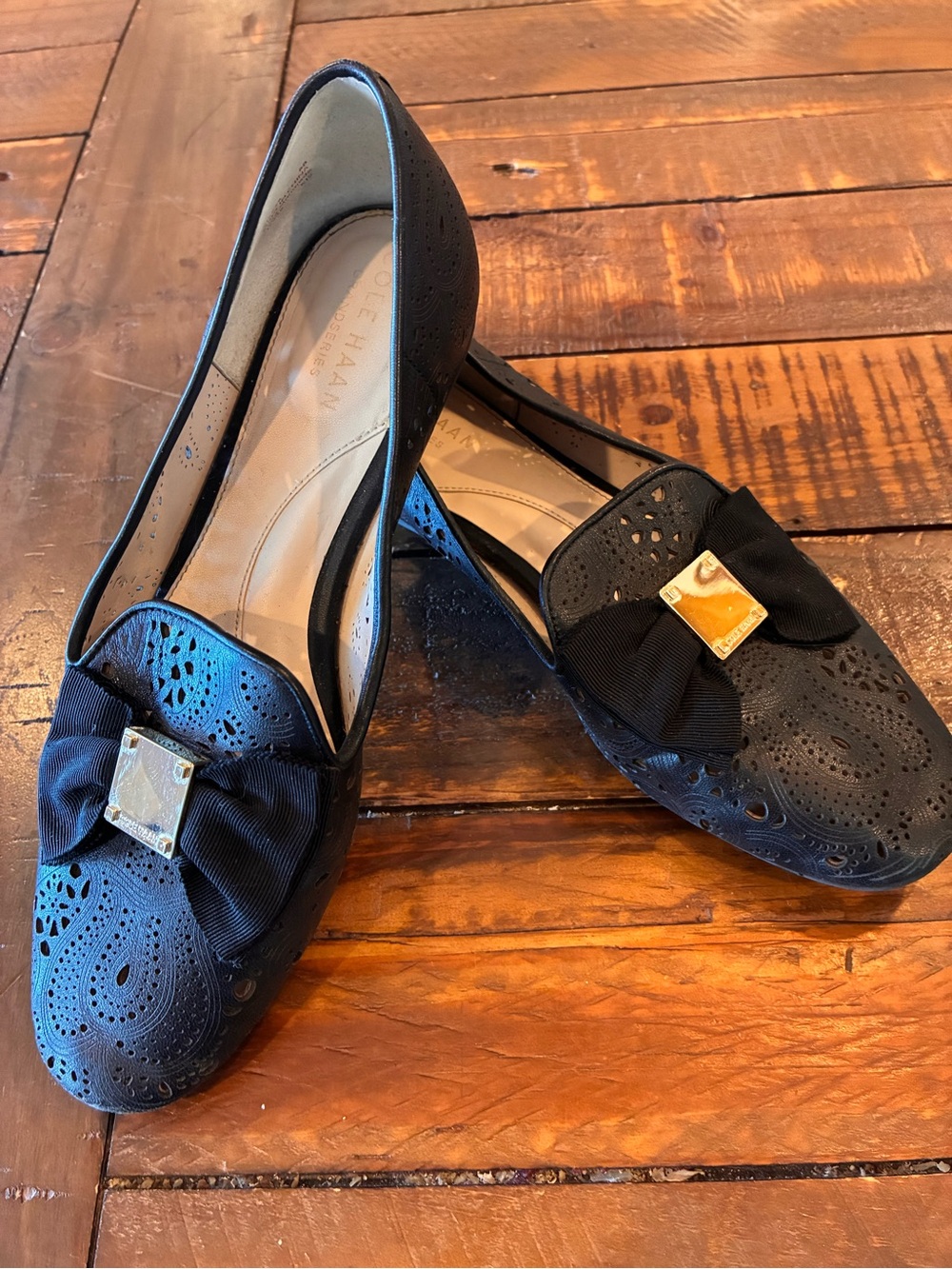 Cole Haan Black Perforated Leather Bow Loafers with Gold Accent